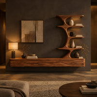 Floating media stand with wave carved fronts and a sculptural tiered shelf tower in a dark living room at golden hour