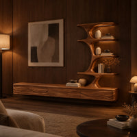 Floating media stand with wave carved fronts and a sculptural tiered shelf tower in an evening living room with walnut wall paneling