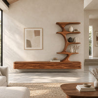 Floating media stand with wave carved fronts and a sculptural tiered shelf tower in a bright open plan living room