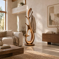 Floor lamp with an open loop body, short pegs and a small side tray in a bright open plan living room
