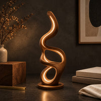 Corner detail of floor lamp with serpentine loops and a small flat ledge beside wood, brass and linen samples