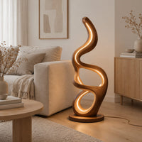 Floor lamp with serpentine loops and a small flat ledge in a Scandinavian living room with white walls