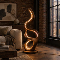 Floor lamp with serpentine loops and a small flat ledge in an industrial loft living room with exposed brick