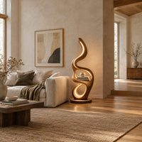Floor lamp with serpentine loops and a small flat ledge in a bright open plan living room