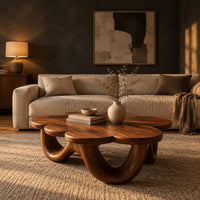 Flower shaped coffee table on a base of looping rounded arches in a dark living room at golden hour