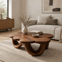 Flower shaped coffee table on a base of looping rounded arches in a Scandinavian living room with white walls