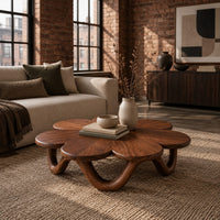 Flower shaped coffee table on a looping wave base in an industrial loft living room with exposed brick