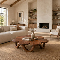 Flower shaped coffee table on a looping wave base in a bright open plan living room