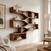 Wall shelf with three stepped tiers of open bays joined by smooth flowing bands in a Scandinavian living room with white walls