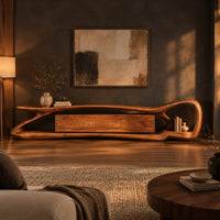 Tv stand with a flowing loop frame wrapping a wood grain center cabinet in a dark living room at golden hour