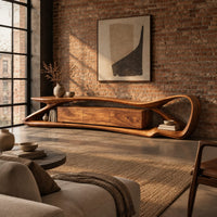 Tv stand with a flowing loop frame wrapping a wood grain center cabinet in an industrial loft living room with exposed brick