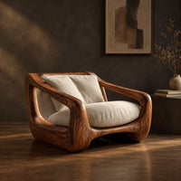 Wooden lounge chair with open sculpted arms and a cushioned seat, three-quarter view showing the grain