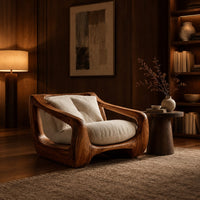 Wooden lounge chair with open sculpted arms and a cushioned seat in an evening living room with walnut wall paneling
