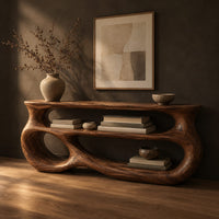 Console table with a sculpted open loop body and stacked oval shelves, three-quarter view showing the grain