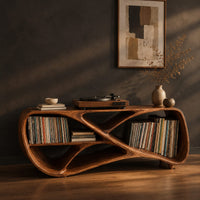 Low freeform console with a crossed ribbon frame and open bays at both ends, three-quarter view showing the grain