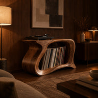 Record player stand with a flowing wave shaped body and one wide open bay in an evening living room with walnut wall paneling