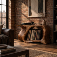 Record player stand with a flowing wave shaped body and one wide open bay in an industrial loft living room with exposed brick