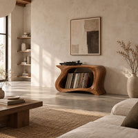 Record player stand with a flowing wave shaped body and one wide open bay in a bright open plan living room