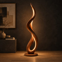 Slim floor lamp shaped as one flowing ribbon with an open loop in a dark studio against a charcoal plaster wall
