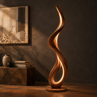 Slim floor lamp shaped as one flowing ribbon with an open loop, three-quarter view showing the grain