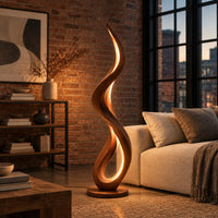 Slim floor lamp shaped as one flowing ribbon with an open loop in an industrial loft living room with exposed brick