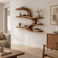 Wall shelf with four open levels joined by a flowing wave form in a Scandinavian living room with white walls
