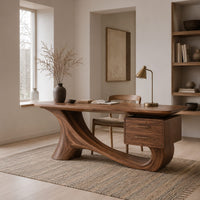 Wooden desk with a flowing sculpted base and two drawers under one end in a Scandinavian home office with white walls