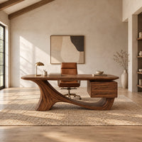 Wooden desk with a flowing sculpted base and two drawers under one end in a bright open plan home office