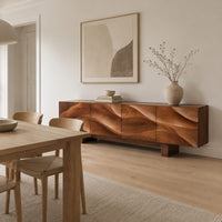 Sideboard with four flowing swirl carved panels on two block feet in a Scandinavian dining room with white walls
