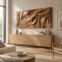 Wide wall art panel carved with flowing leaf vein ridges above a light oak sideboard in daylight