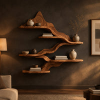 Wavy wall shelves with staggered tiers joined by a flowing band in a dark living room at golden hour