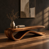 Long bench with a flat slab seat on a flowing wave base, three-quarter view showing the grain