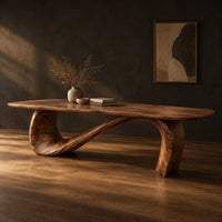 Dining table with a long smooth top on one flowing wave shaped base, three-quarter view showing the grain