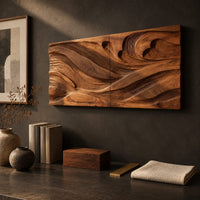 Detail of wide carved wave relief wall panel made of two joined sections beside wood, brass and linen samples