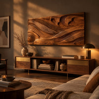 Wide carved wave relief wall panel made of two joined sections above a low console in an evening living room