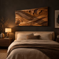 Wide carved wave relief wall panel made of two joined sections above a bed in a dusk lit bedroom