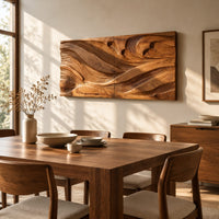 Wide carved wave relief wall panel made of two joined sections beside a dining table in natural light