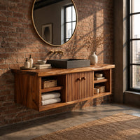 Floating vanity with fluted doors and open side shelves on both ends in an industrial loft bathroom with exposed brick