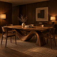 Dining table with a fluted wave shaped pedestal and rectangular top in an evening dining room with walnut wall paneling