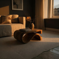 Folded S ribbon coffee table in a living room at golden hour