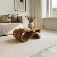 Folded S ribbon coffee table in a bright modern living room