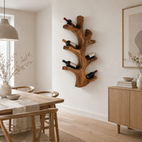 Wine rack shaped like a branching tree trunk with forked arms for bottles in a Scandinavian dining room with white walls