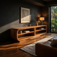 Rounded TV cabinet with four open cubbies in a living room at golden hour