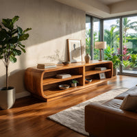 Rounded TV cabinet with four open cubbies in an open plan space in daylight