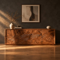 Tv stand with four doors carved with one ocean wave in a dark studio against a charcoal plaster wall