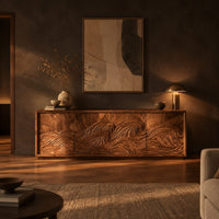 Tv stand with four doors carved with one ocean wave in a dark living room at golden hour