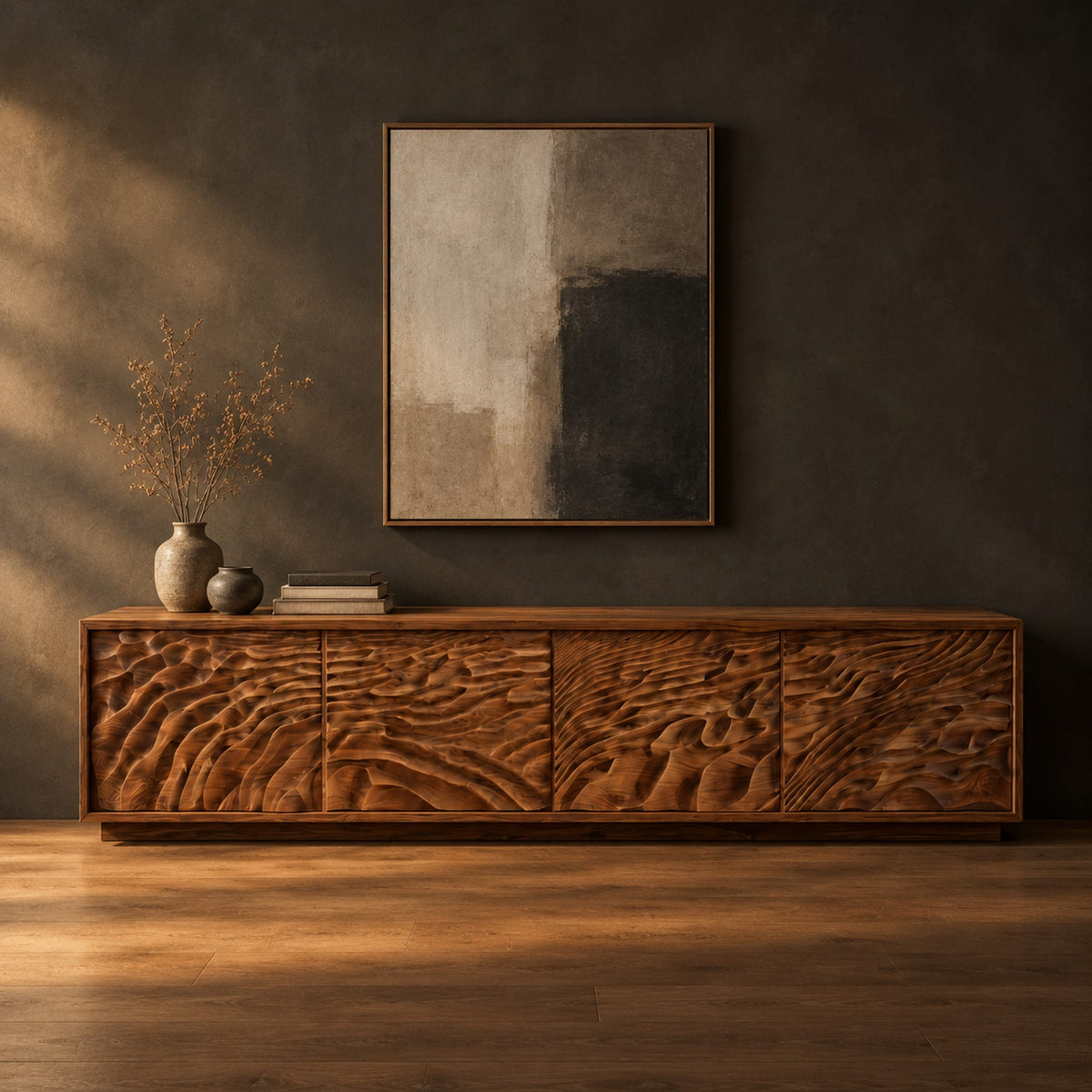 Long low tv stand with four doors carved in deep rippling wave relief in a dark studio against a charcoal plaster wall