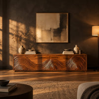 Tv stand with four doors carved in swirling wave ridges in a dark living room at golden hour