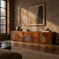 Tv stand with four doors carved in swirling wave ridges in an industrial loft living room with exposed brick