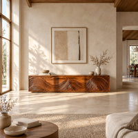 Tv stand with four doors carved in swirling wave ridges in a bright open plan living room